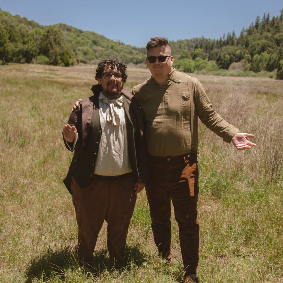 aj and nic in a field dressed like hobbits